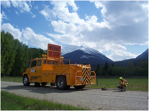 Technician setting up the Benkelman Beam to measure road strength.