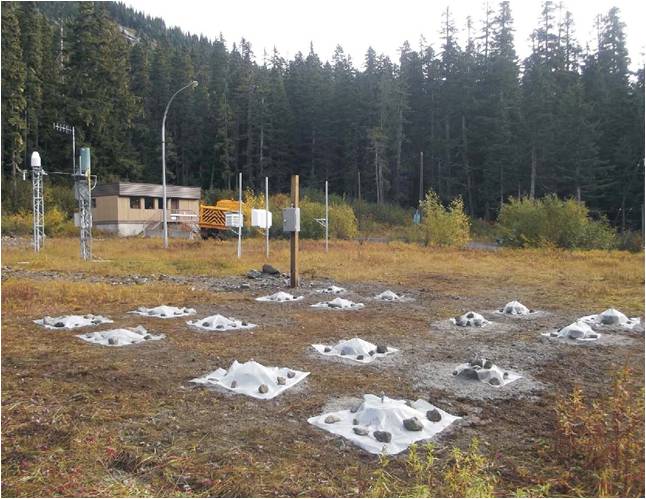 Experimental precipitation measuring and analyzing equipment being installed at the Coquihalla Summit 