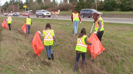 picking up garbage along the highway