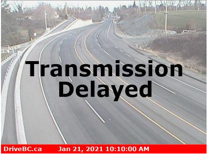 Highway webcam image with "Transmission Delayed" messaging