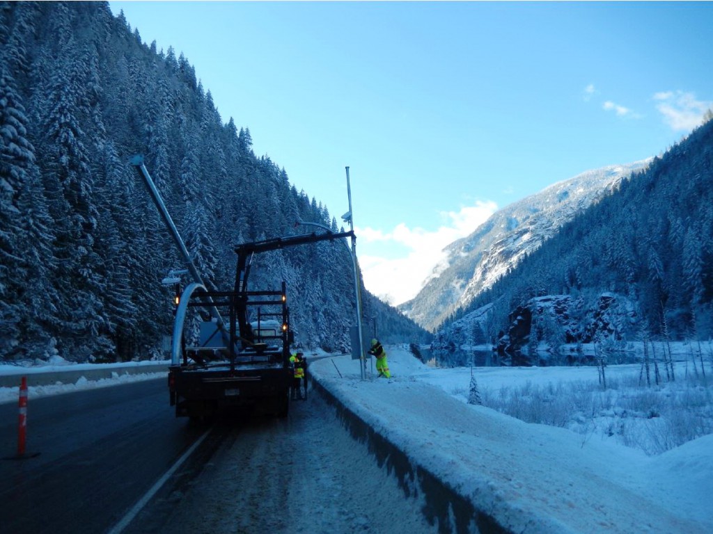 Installing variable speed limit sign on Highway 1 in November, 2015.