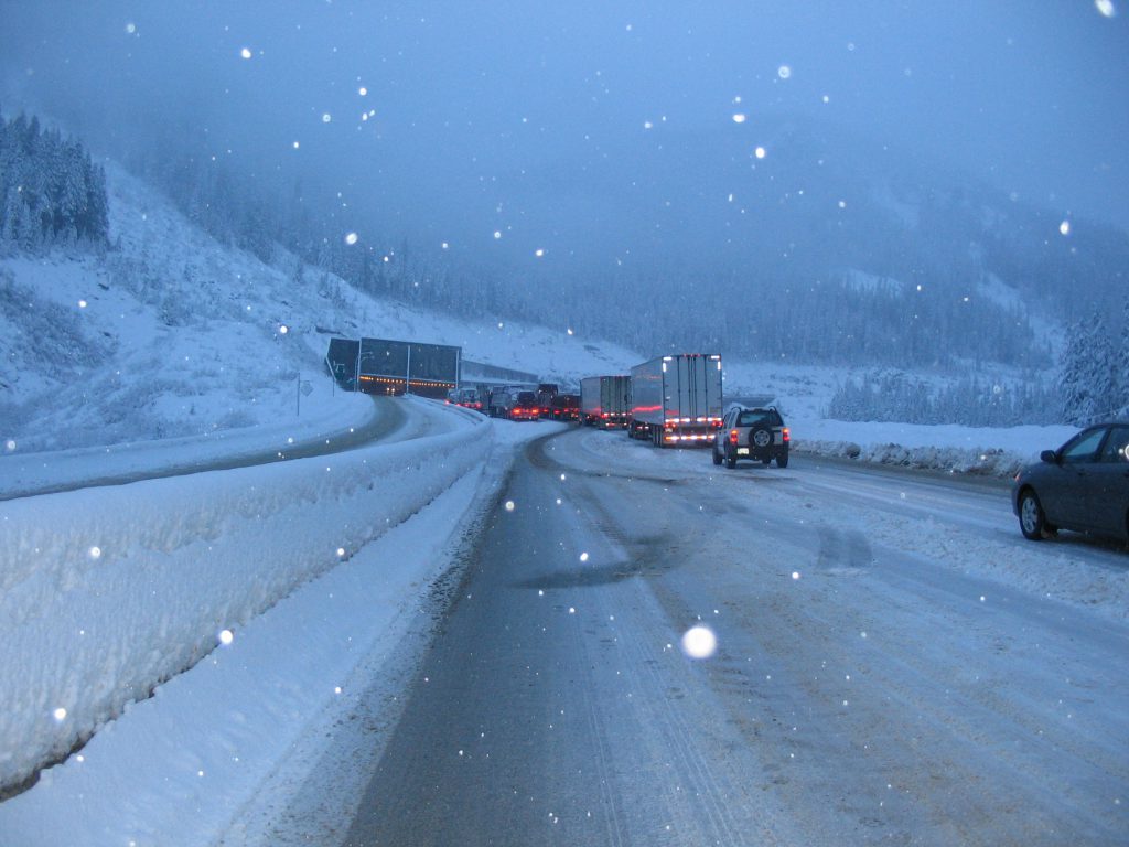 Commercial vehicles blocking traffic during snow storm on Snowshed Hill