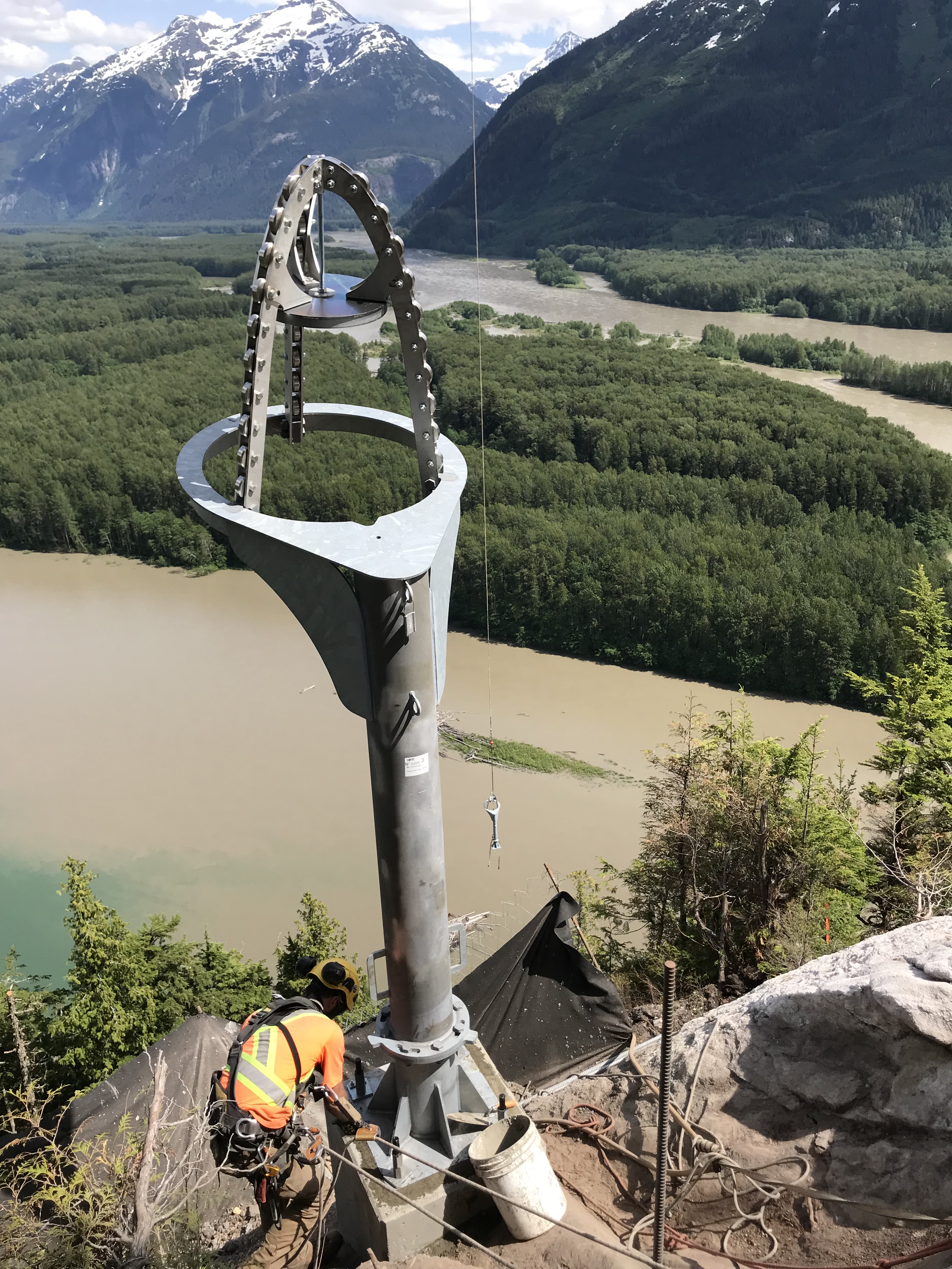 worker inspecting obellx mount on mountain