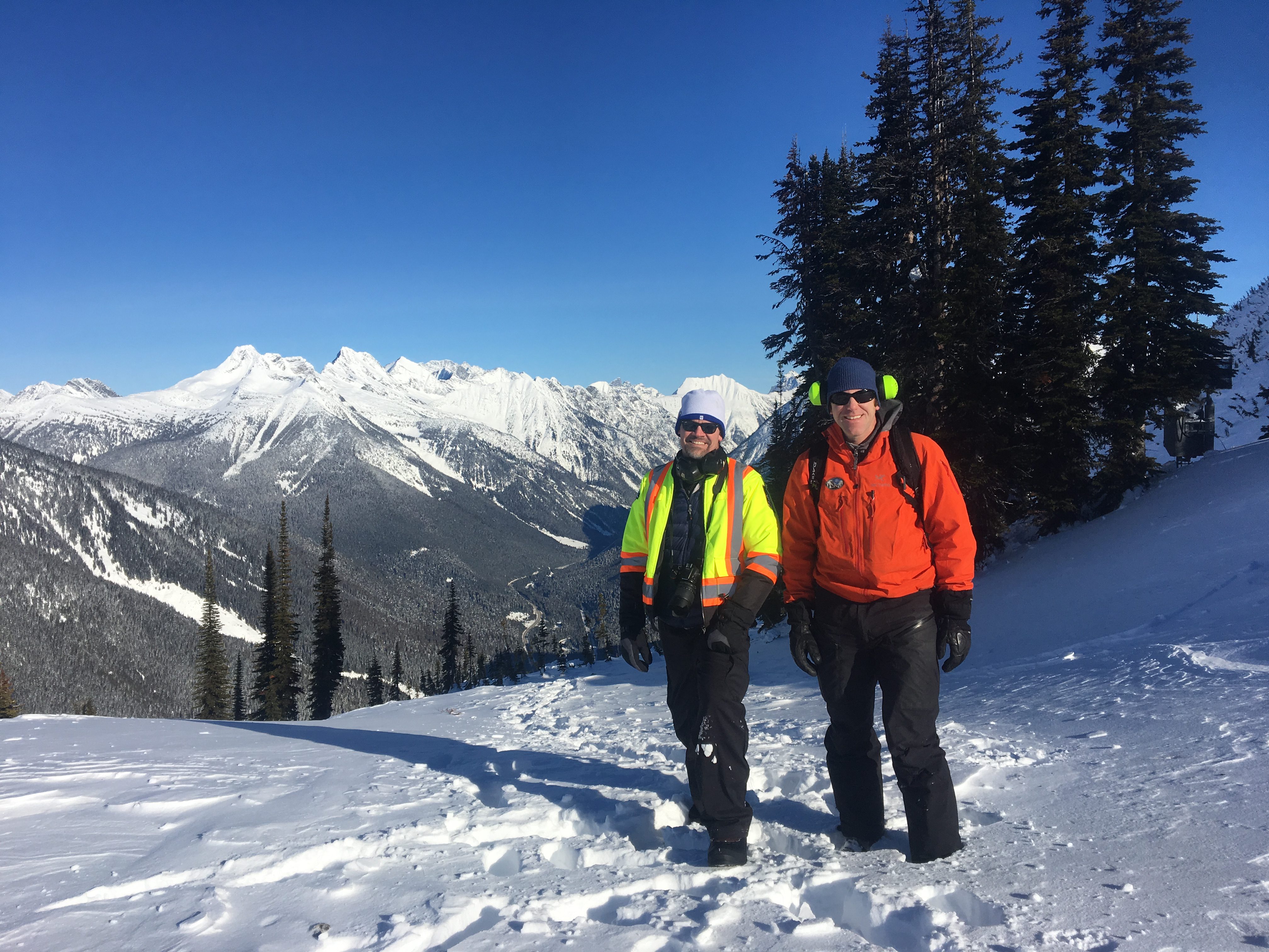 Ministry district manager and avalanche technician surveying snow