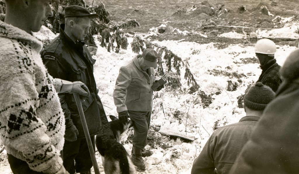 Former British Columbia Highways Minister Phil Gaglardi (above with search and rescue canine), attended the scene to help assist with search and rescue efforts and to help direct the construction of a temporary road over the southern portion of the slide.