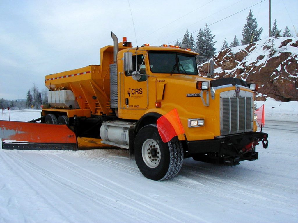 Wing plow and underbody plow working together to clear the highway.