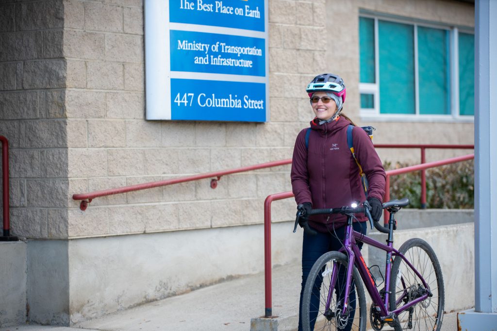 Woman walking bike