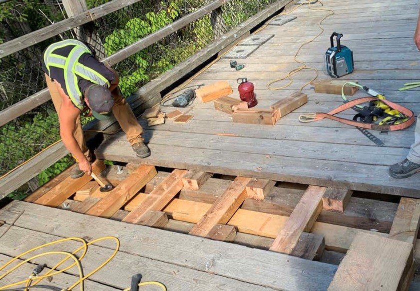 Worker upgrading trestle