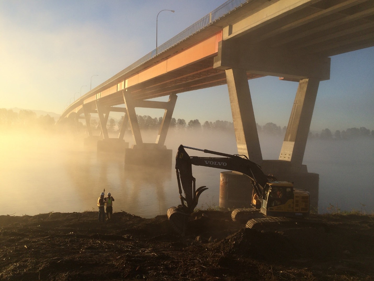 Workers at the site of the Mission River Bridge during seismic upgrades