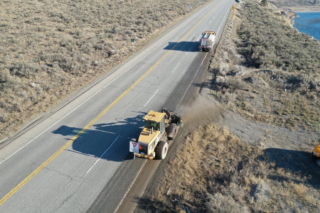 maintenance vehicles sweeping along bc highway