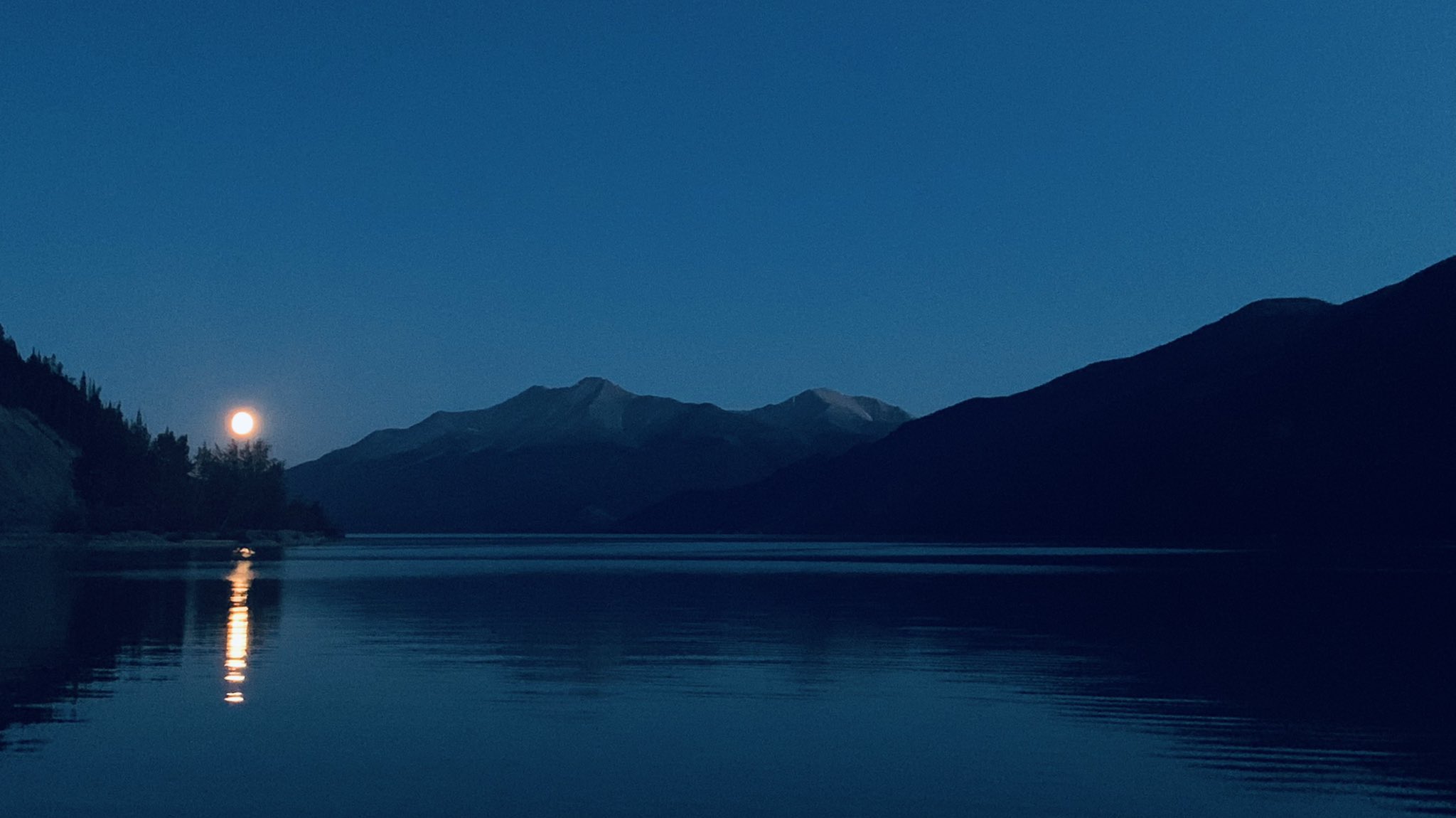 Near full moon over lake