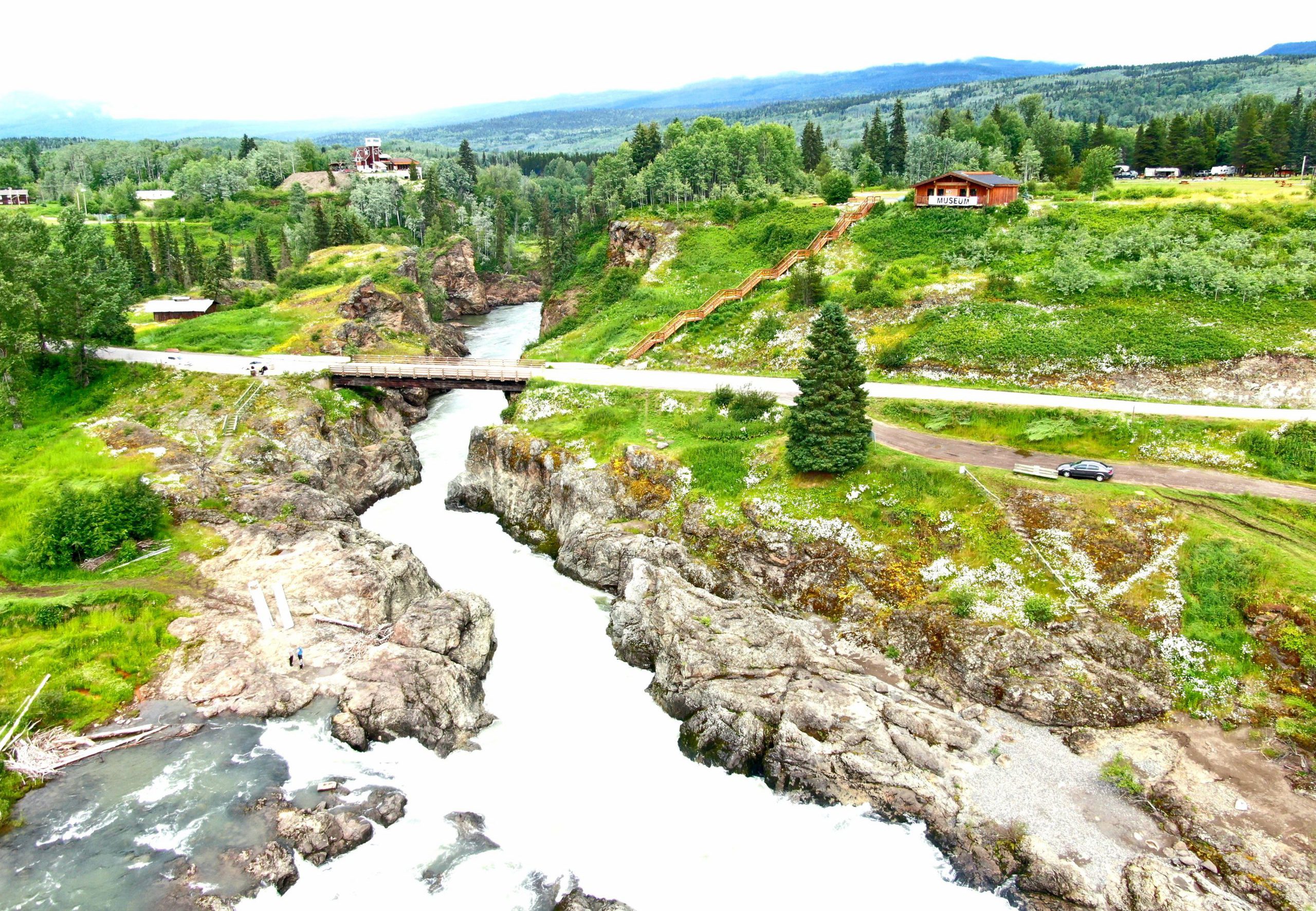 Green hills with bridge over river