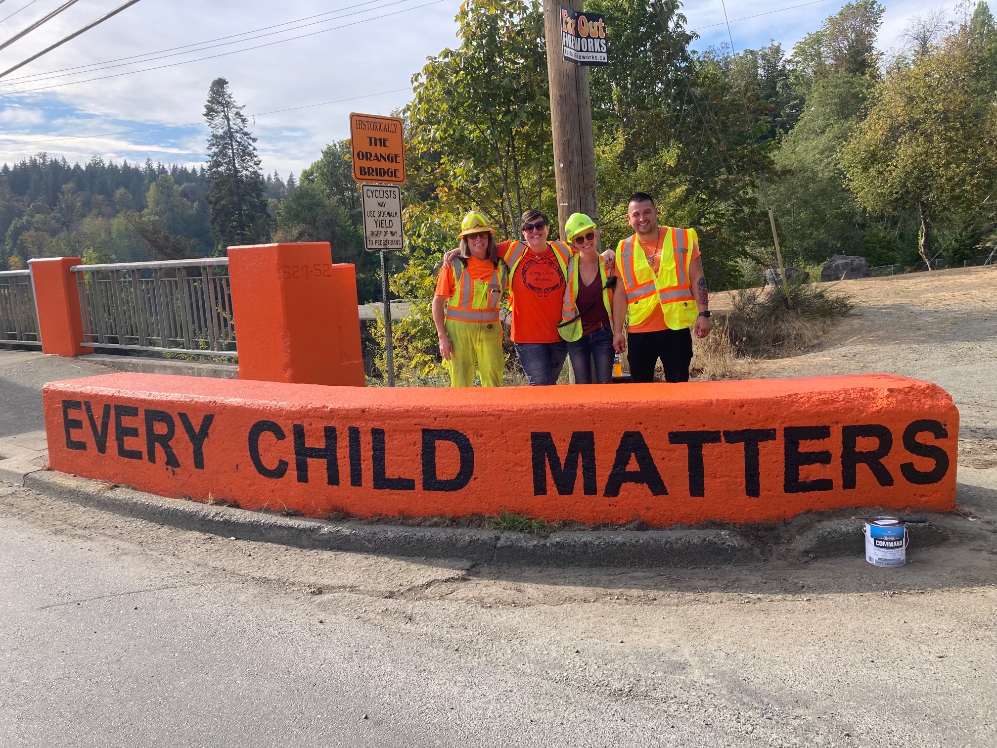 Painter standing behind every child matters barrier