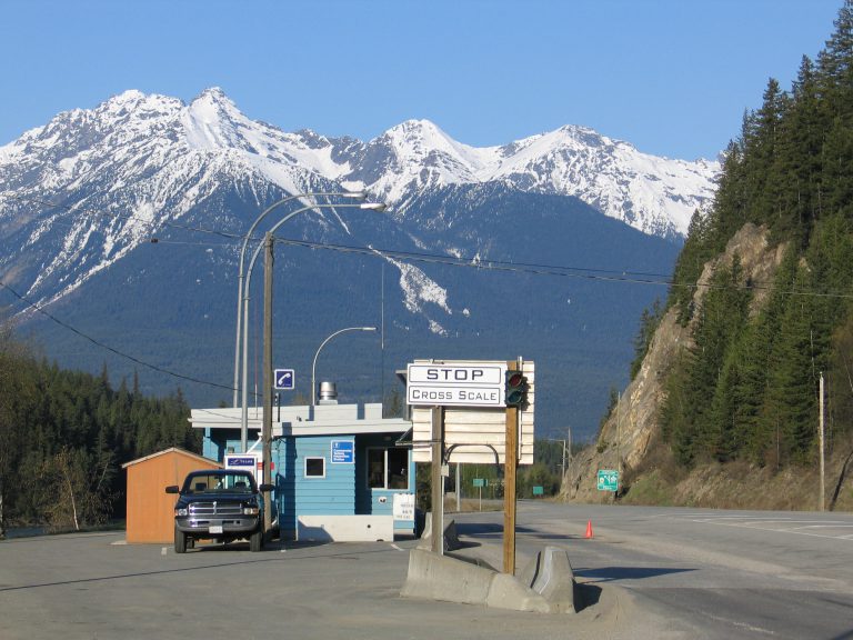 weigh scale with mountains in background