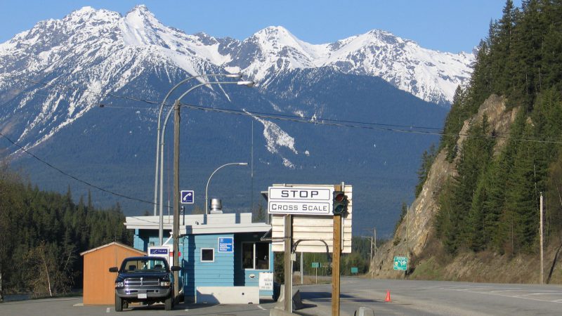 weigh scale with mountains in background